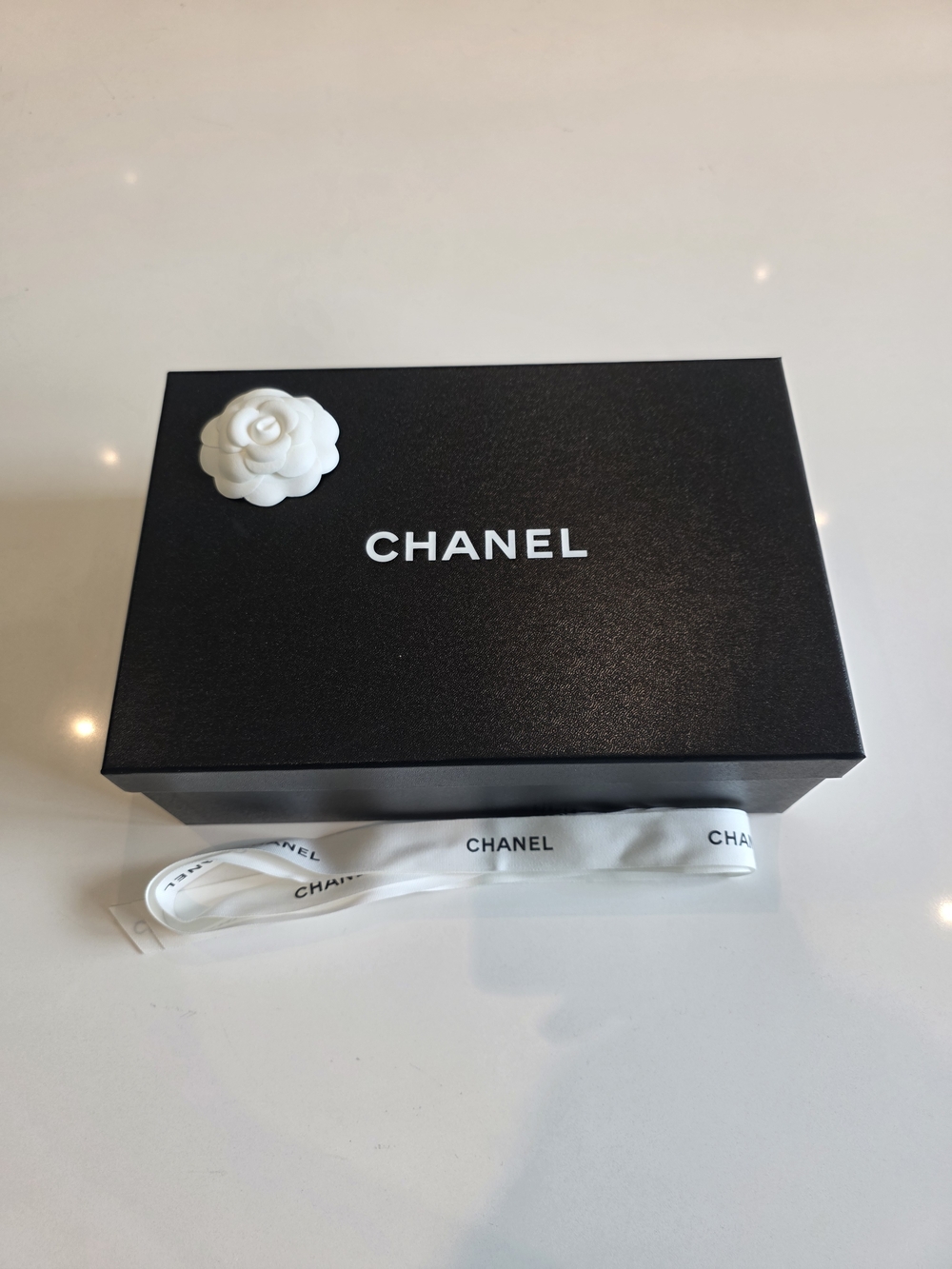 CHANEL Black Box with White Camellia and Ribbon